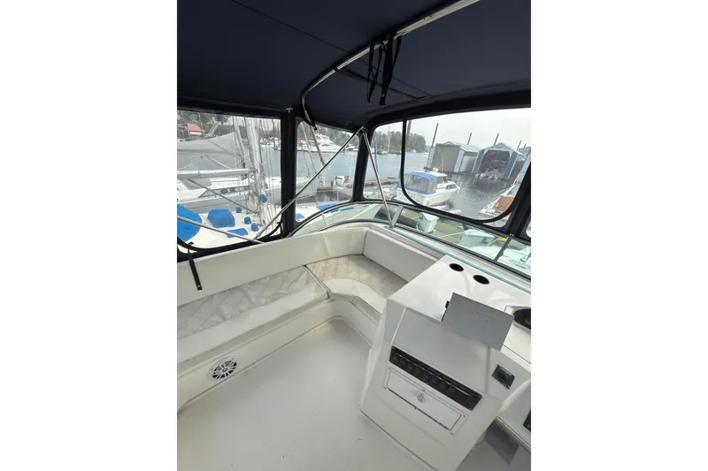 Slide: The Image of 1997 Bayliner 3788 Command Bridge Motoryacht interior with marina view. - 10