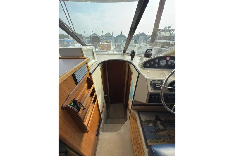Slide: The Image of Interior view of 1997 Bayliner 3788 Command Bridge Motoryacht cockpit and controls. - 28