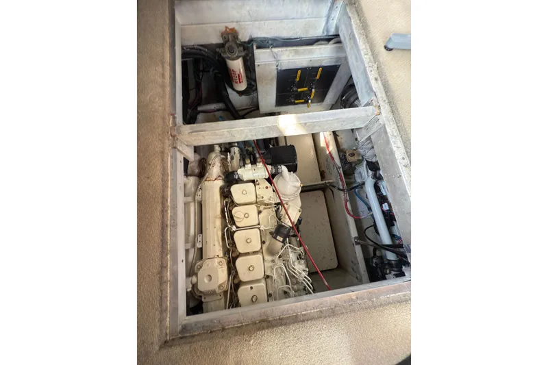 Slide: The Image of Engine compartment of 1997 Bayliner 3788 Command Bridge Motoryacht, showcasing mechanical components. - 36