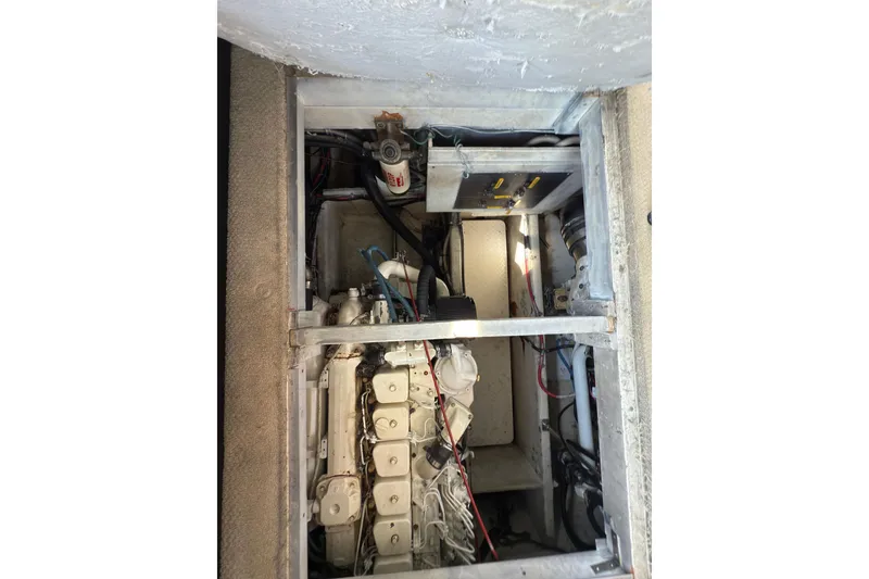 Slide: The Image of Engine compartment of 1997 Bayliner 3788 Command Bridge Motoryacht, showcasing mechanical components. - 37