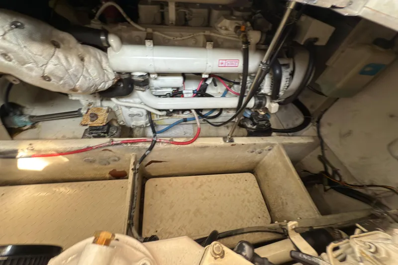 Slide: The Image of Engine compartment of a 1997 Bayliner 3788 Command Bridge Motoryacht, showing mechanical components. - 38