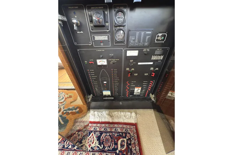 Slide: The Image of Control panel of 1997 Bayliner 3788 Command Bridge Motoryacht with gauges and switches. - 39