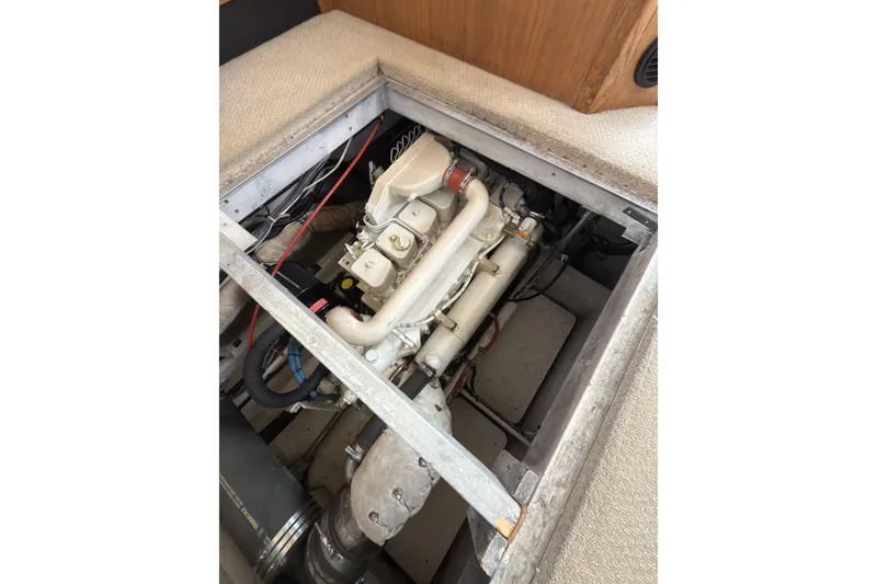Slide: The Image of Engine compartment of 1997 Bayliner 3788 Command Bridge Motoryacht, showcasing mechanical components. - 40