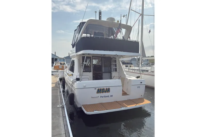 Slide: The Image of 1997 Bayliner 3788 Command Bridge Motoryacht docked in Portland marina. - 6