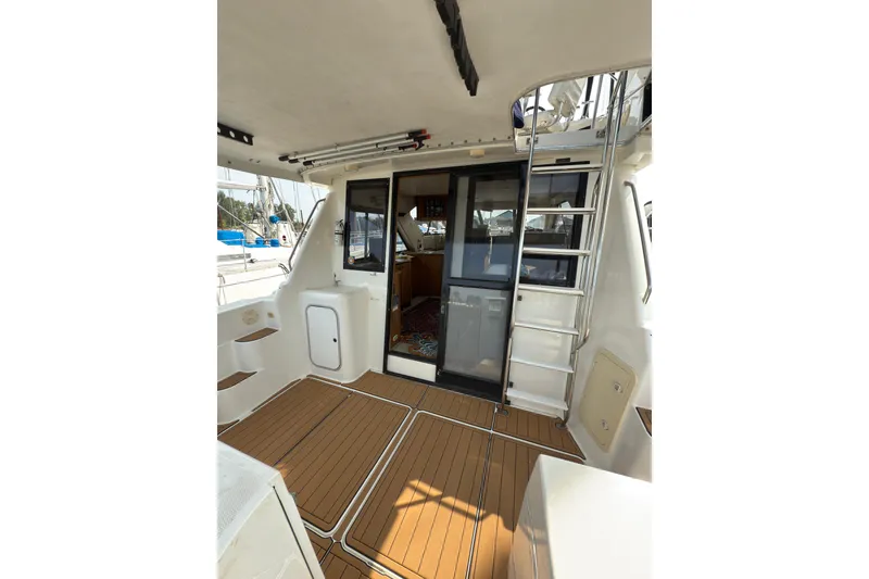 Slide: The Image of 1997 Bayliner 3788 Command Bridge Motoryacht with teak deck and ladder. - 8