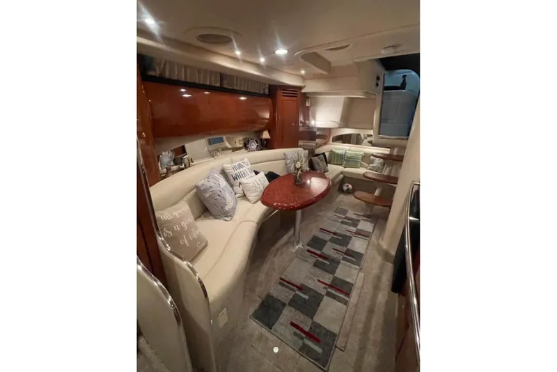 Slide: The Image of Luxurious interior of a 2003 Sea Ray 360 Sundancer yacht with elegant seating and decor. - 10