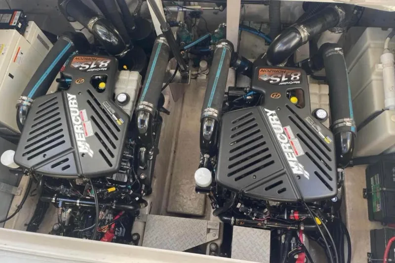 Slide: The Image of Engine room of a 2003 Sea Ray 360 Sundancer with twin Mercury engines. - 13