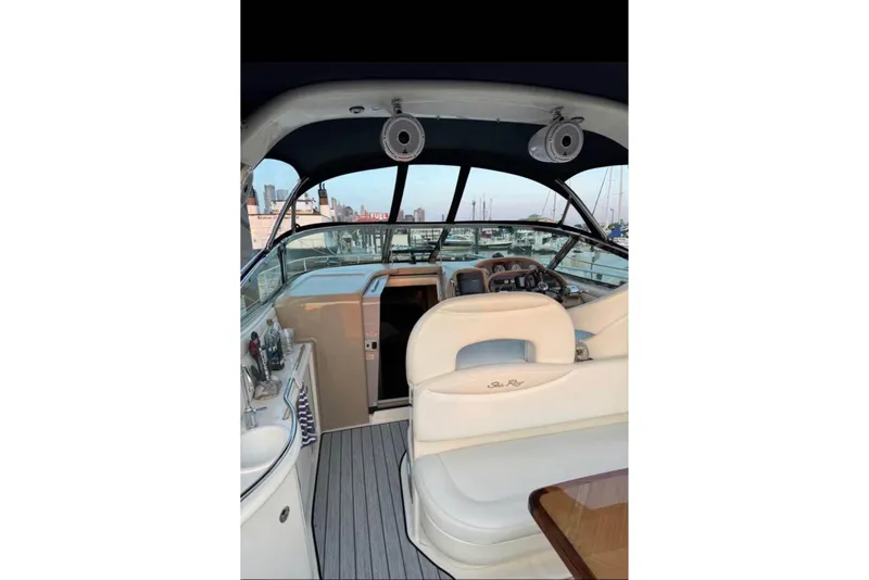 Slide: The Image of Interior view of 2003 Sea Ray 360 Sundancer yacht with helm and seating area. - 4