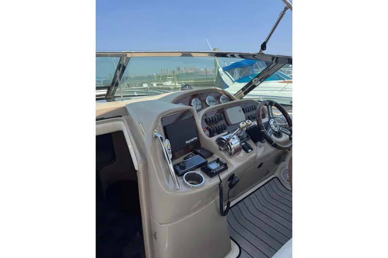 Slide: The Image of 2003 Sea Ray 360 Sundancer helm with modern navigation equipment and controls. - 6