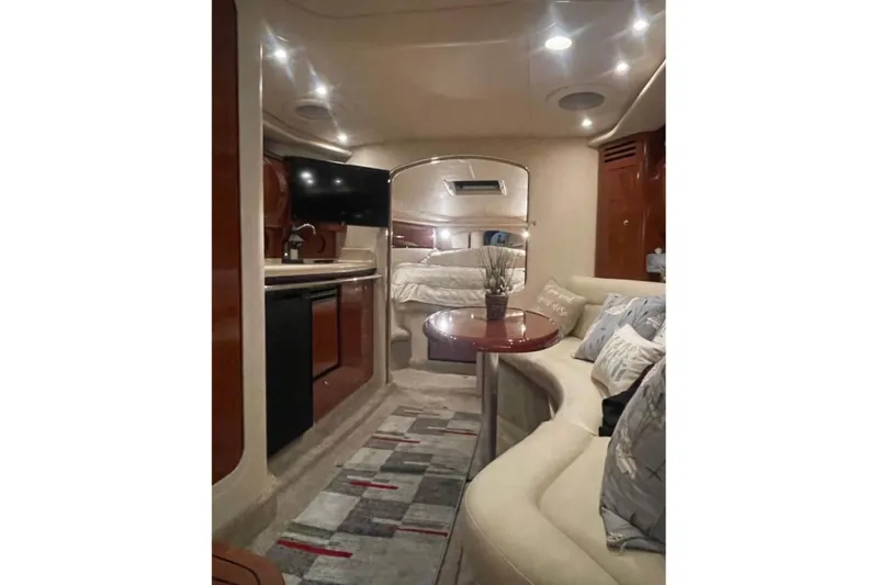 Slide: The Image of Luxurious interior of 2003 Sea Ray 360 Sundancer yacht with cozy seating and modern amenities. - 9