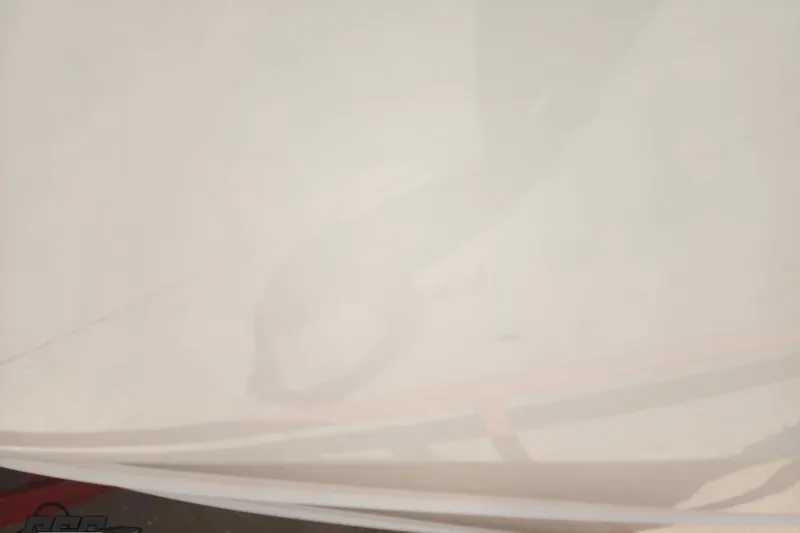 Slide: The Image of Blurry image of a 2005 Baja 242 Islander boat surface. - 13