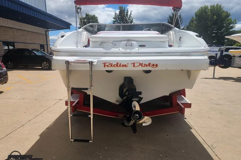 Slide: The Image of 2005 Baja 242 Islander boat on trailer, rear view with "Ridin' Dirty" text. - 14