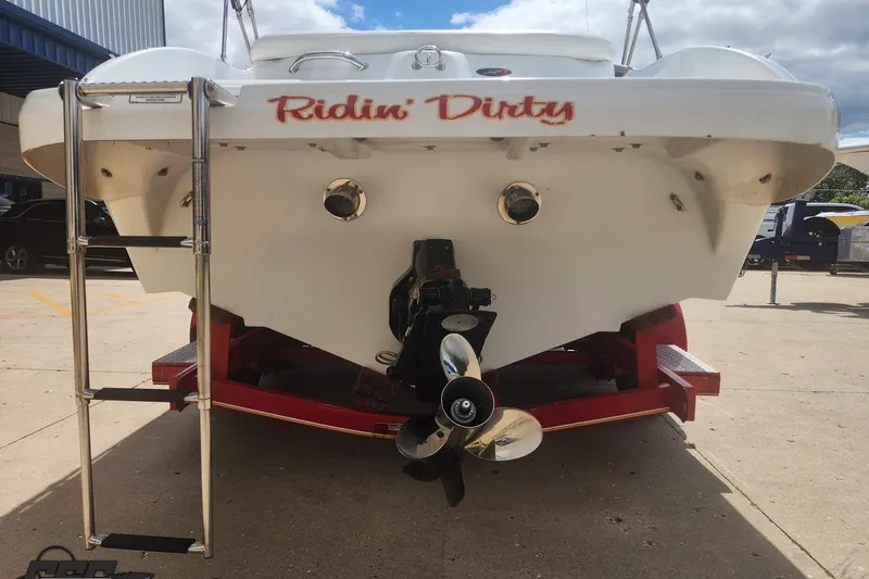 Slide: The Image of Rear view of 2005 Baja 242 Islander boat with "Ridin' Dirty" text. - 17