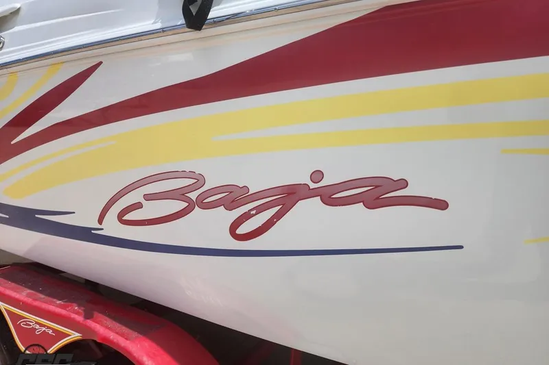 Slide: The Image of 2005 Baja 242 Islander boat with colorful graphics and logo. - 19