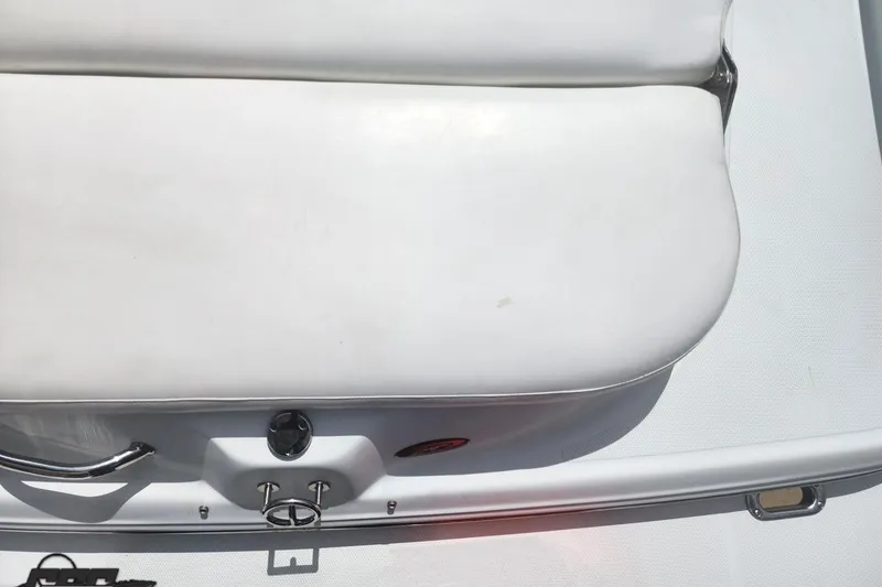 Slide: The Image of 2005 Baja 242 Islander boat seat, white upholstery, close-up view. - 22