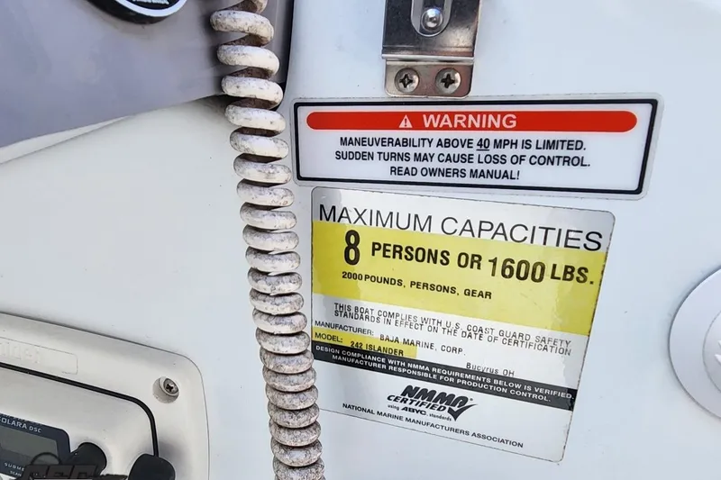 Slide: The Image of Warning label on 2005 Baja 242 Islander boat, capacity 8 persons or 1600 lbs. - 33