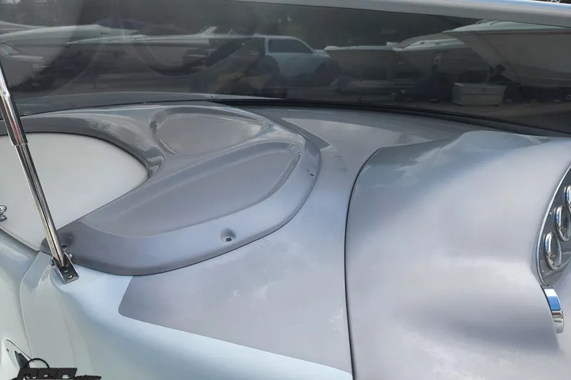 Slide: The Image of 2005 Baja 242 Islander boat dashboard with sleek design and modern controls. - 36