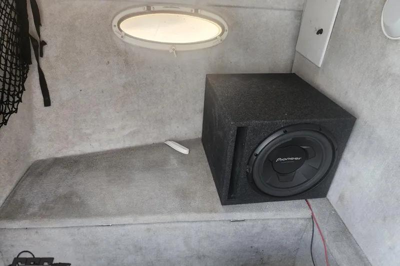 Slide: The Image of Interior of 2005 Baja 242 Islander with Pioneer subwoofer and small window. - 40