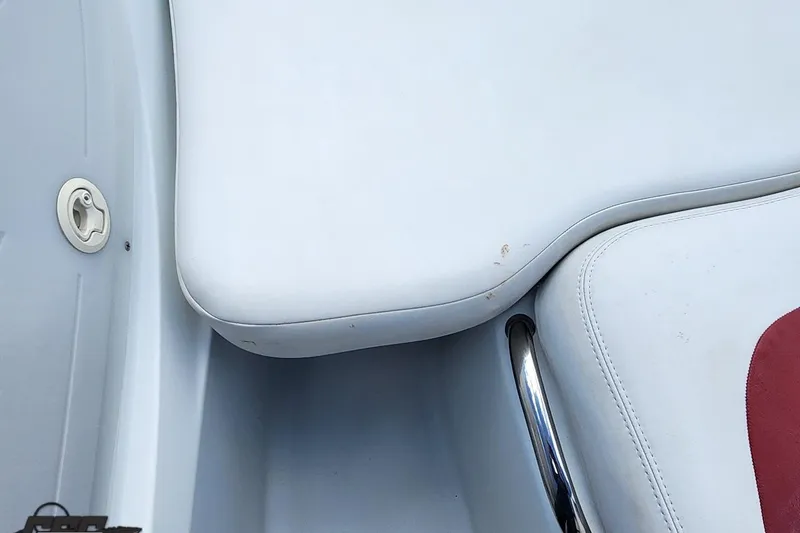 Slide: The Image of 2005 Baja 242 Islander boat interior with white and red seating detail. - 43