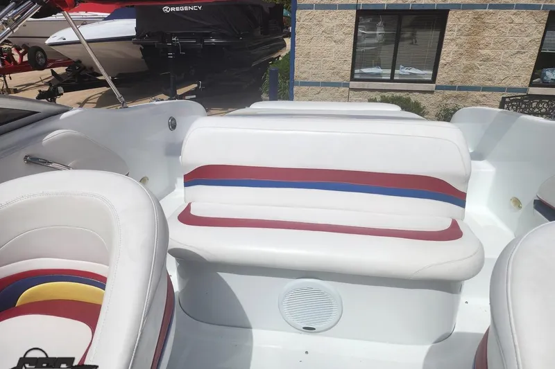 Slide: The Image of 2005 Baja 242 Islander boat interior with white, red, and blue seating. - 54