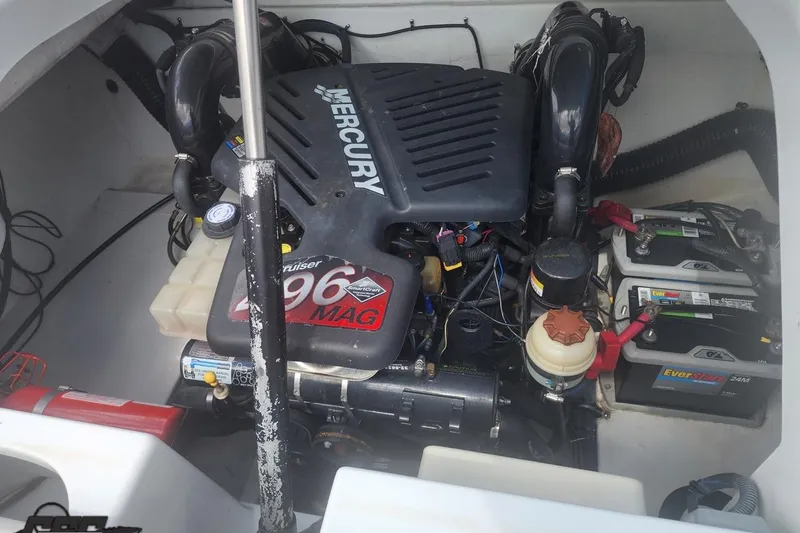 Slide: The Image of Engine compartment of a 2005 Baja 242 Islander boat with Mercury 496 MAG engine. - 60