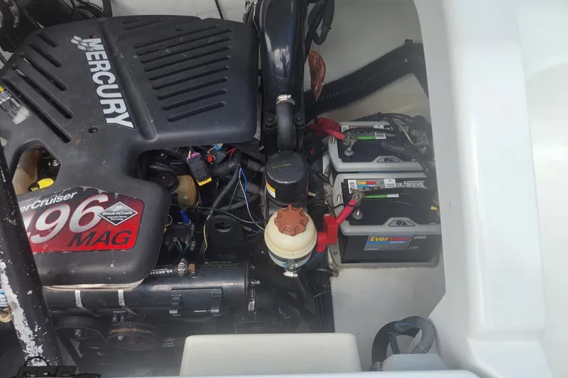 Slide: The Image of Engine compartment of a 2005 Baja 242 Islander with Mercury 496 MAG engine and dual batteries. - 61