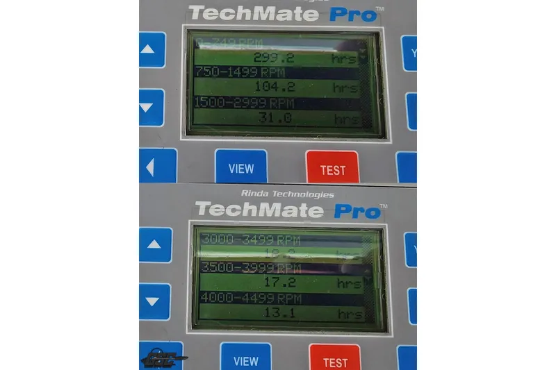 Slide: The Image of TechMate Pro display showing engine hours for Baja 242 Islander 2005 at various RPM ranges. - 64