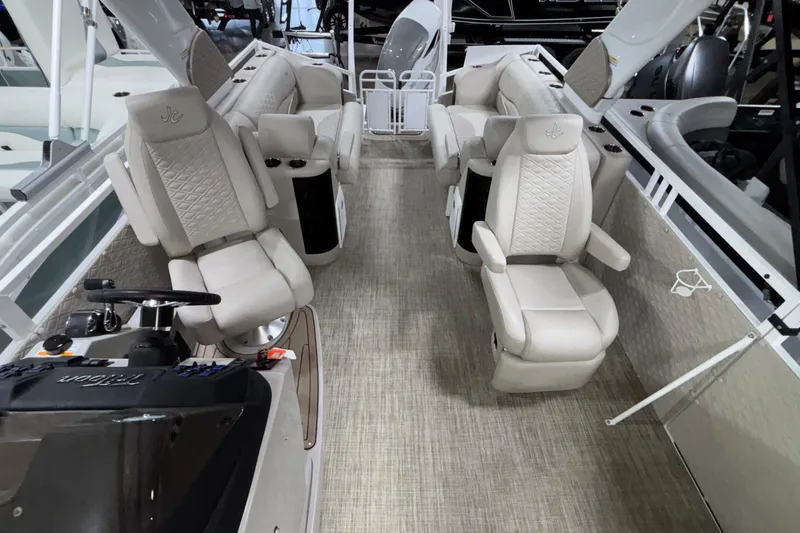 Slide: The Image of Interior of a 2026 JC Sporttoon 26TT boat with luxurious seating and modern design. - 15