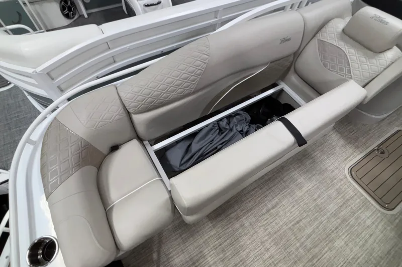 Slide: The Image of Luxurious seating with storage on 2026 JC Sporttoon 26TT boat, featuring elegant diamond-pattern upholstery. - 29