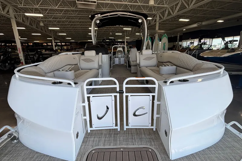 Slide: The Image of 2026 JC Sporttoon 26TT pontoon boat interior with luxurious seating in showroom. - 3