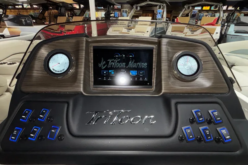 Slide: The Image of Dashboard of 2026 JC Sporttoon 26TT boat with modern controls and gauges. - 33