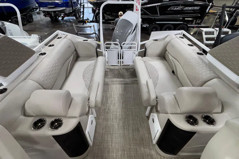 Slide: The Image of Luxurious interior of 2026 JC Sporttoon 26TT pontoon boat with plush seating and cup holders. - 12