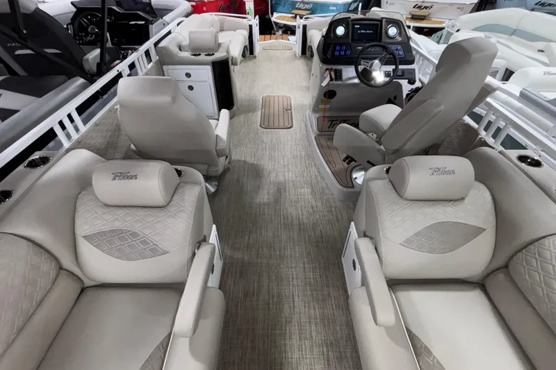 Slide: The Image of Luxurious interior of 2026 JC Sporttoon 26TT pontoon boat with plush seating and modern dashboard. - 13