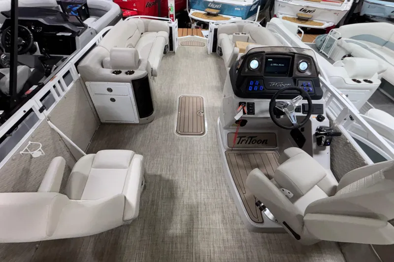 Slide: The Image of Interior of 2026 JC Sporttoon 26TT pontoon boat with luxurious seating and modern dashboard. - 14