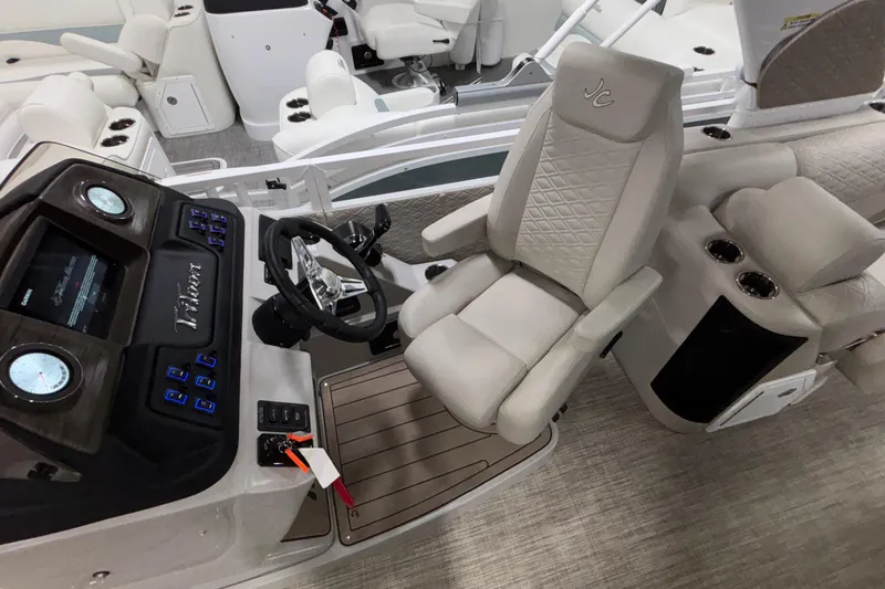 Slide: The Image of Interior of 2026 JC Sporttoon 26TT boat with luxurious seating and modern dashboard. - 17