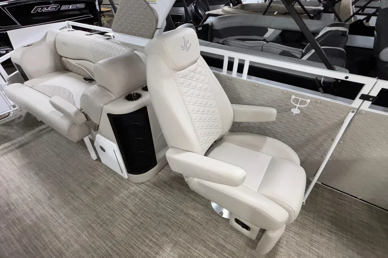 Slide: The Image of Luxurious seating on 2026 JC Sporttoon 26TT boat with quilted upholstery and cup holders. - 18