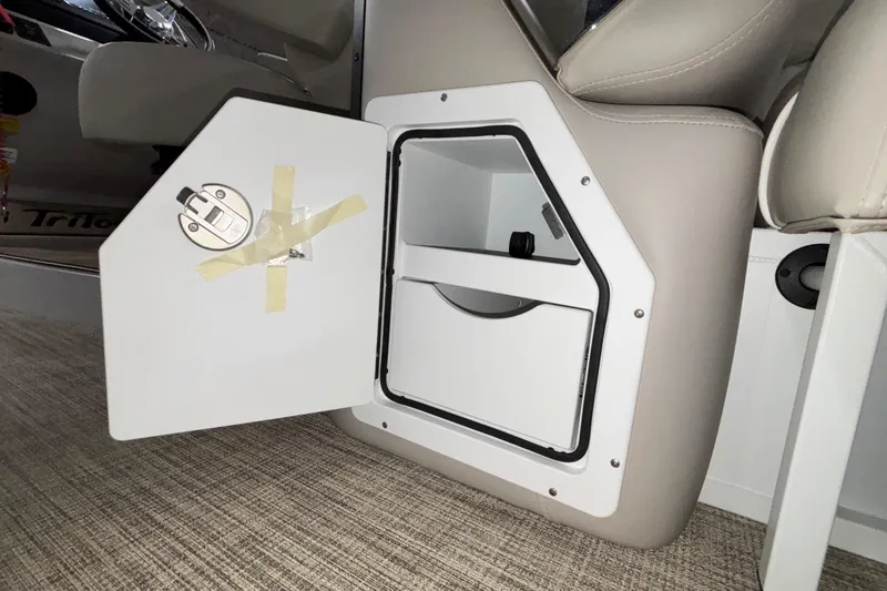 Slide: The Image of Open storage compartment in 2026 JC Sporttoon 26TT boat interior. - 22