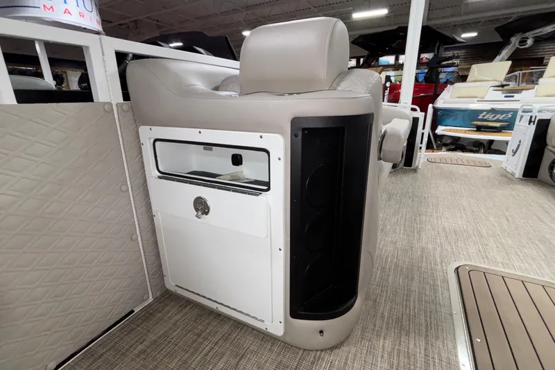 Slide: The Image of Interior of a 2026 JC Sporttoon 26TT boat, featuring seating and storage compartments. - 25