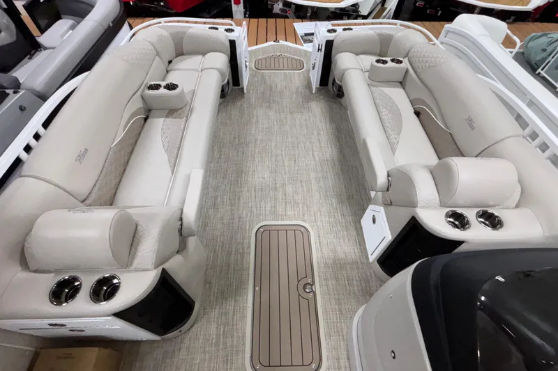 Slide: The Image of Luxurious interior of 2026 JC Sporttoon 26TT pontoon boat with plush seating and cup holders. - 26