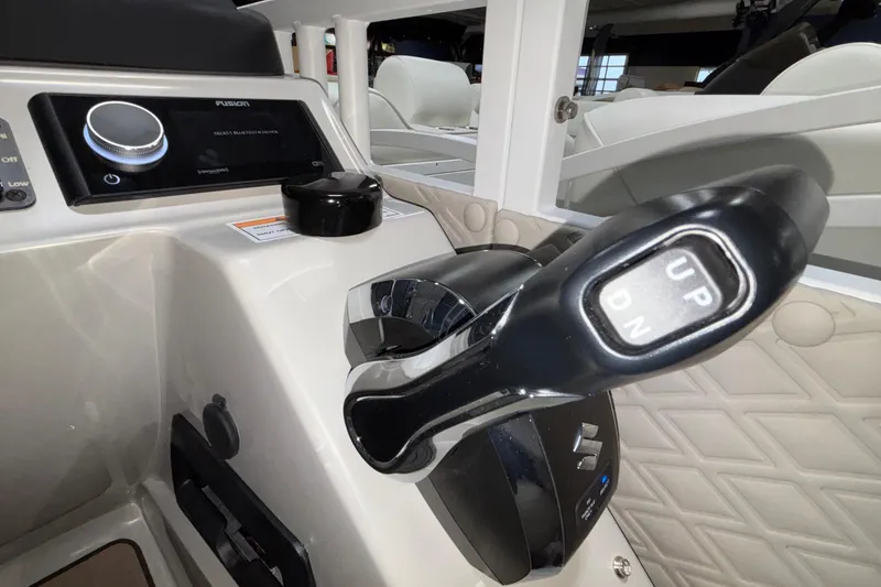 Slide: The Image of Control panel of 2026 JC Sporttoon 26TT boat with throttle lever and audio system. - 36