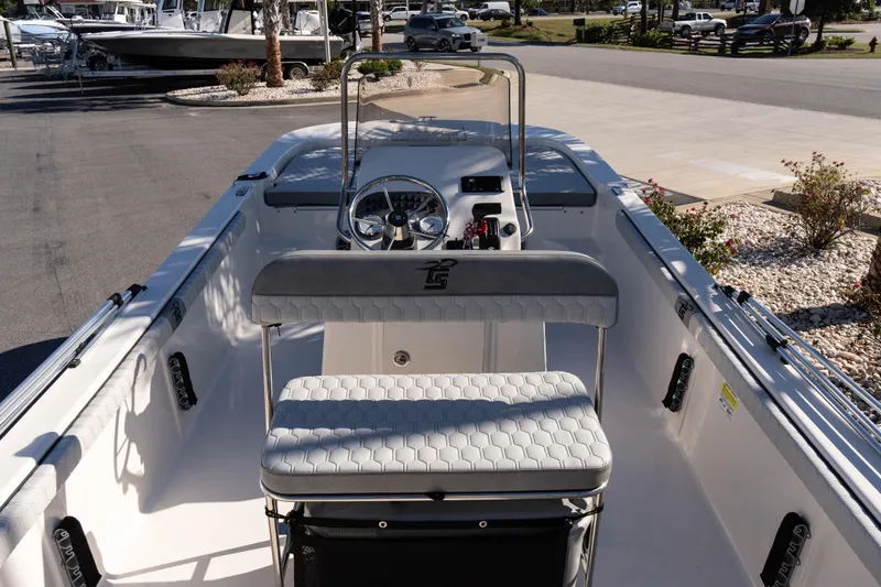 Slide: The Image of 2026 Carolina Skiff 21 LS boat interior with steering console and seating. - 10