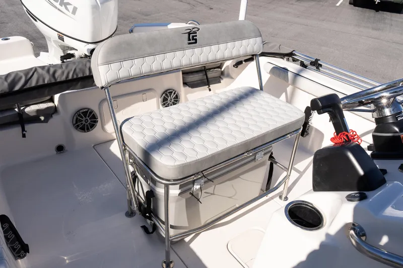 Slide: The Image of 2026 Carolina Skiff 21 LS boat interior with cushioned seating and storage. - 12