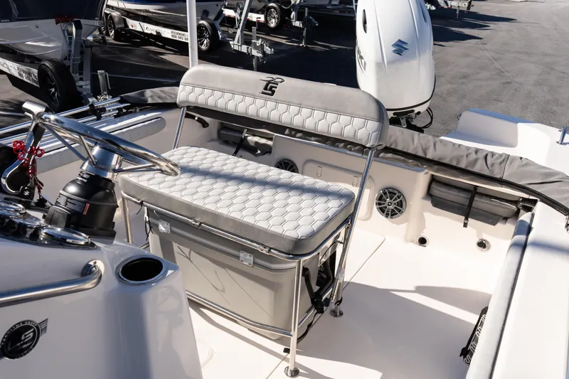 Slide: The Image of 2026 Carolina Skiff 21 LS boat interior with steering wheel and seating. - 13