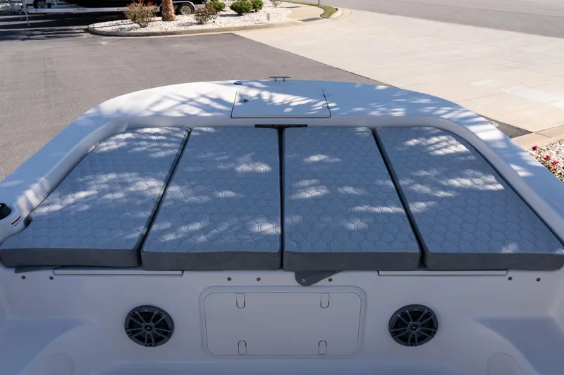 Slide: The Image of 2026 Carolina Skiff 21 LS boat with cushioned seating and storage compartments. - 15