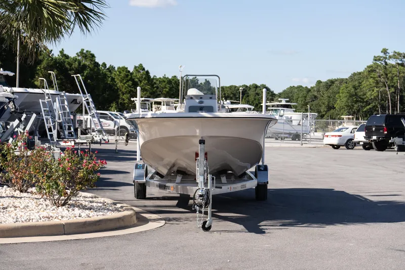Slide: The Image of 2026 Carolina Skiff 21 LS boat on trailer in marina parking lot. - 7