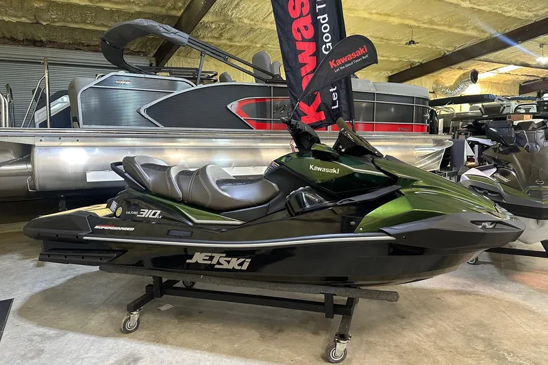 The Image of 2025 Kawasaki Jetski Ultra 310LX in showroom, green and black design, side view. - 1