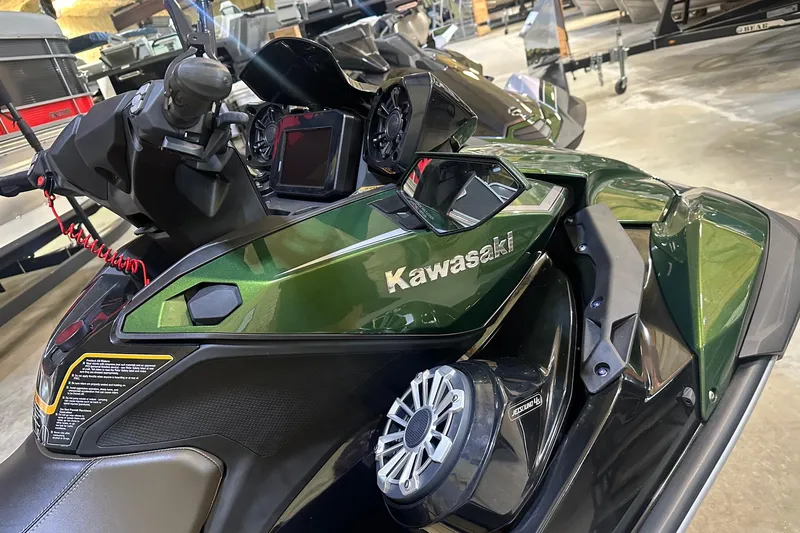 Slide: The Image of 2025 Kawasaki Jetski Ultra 310LX in showroom, featuring sleek design and advanced controls. - 2