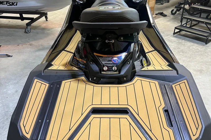 Slide: The Image of 2025 Kawasaki Jetski Ultra 310LX with sleek design and advanced features in a showroom. - 3