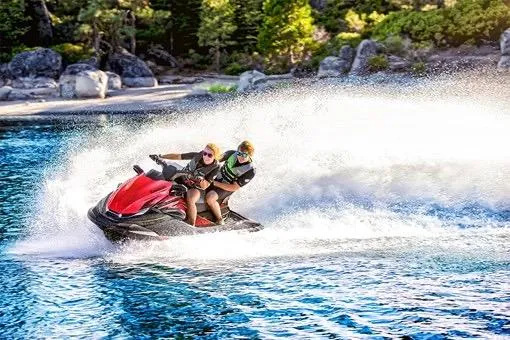 Slide: The Image of 2025 Kawasaki JET SKI STX 160X in sleek red and gray design. - 2