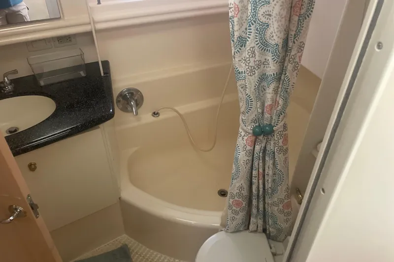 Slide: The Image of Bathroom interior of 2000 Carver 456 Aft Cabin Motor Yacht with shower and sink. - 12